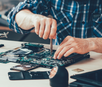 man working on a computer board