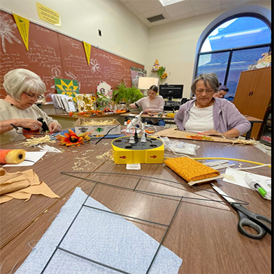 older people working on crafts