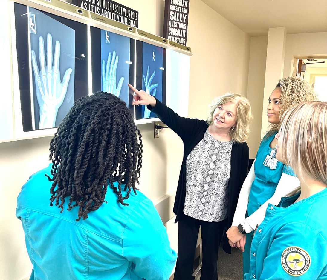 RadTech Instructor showing students an x-ray